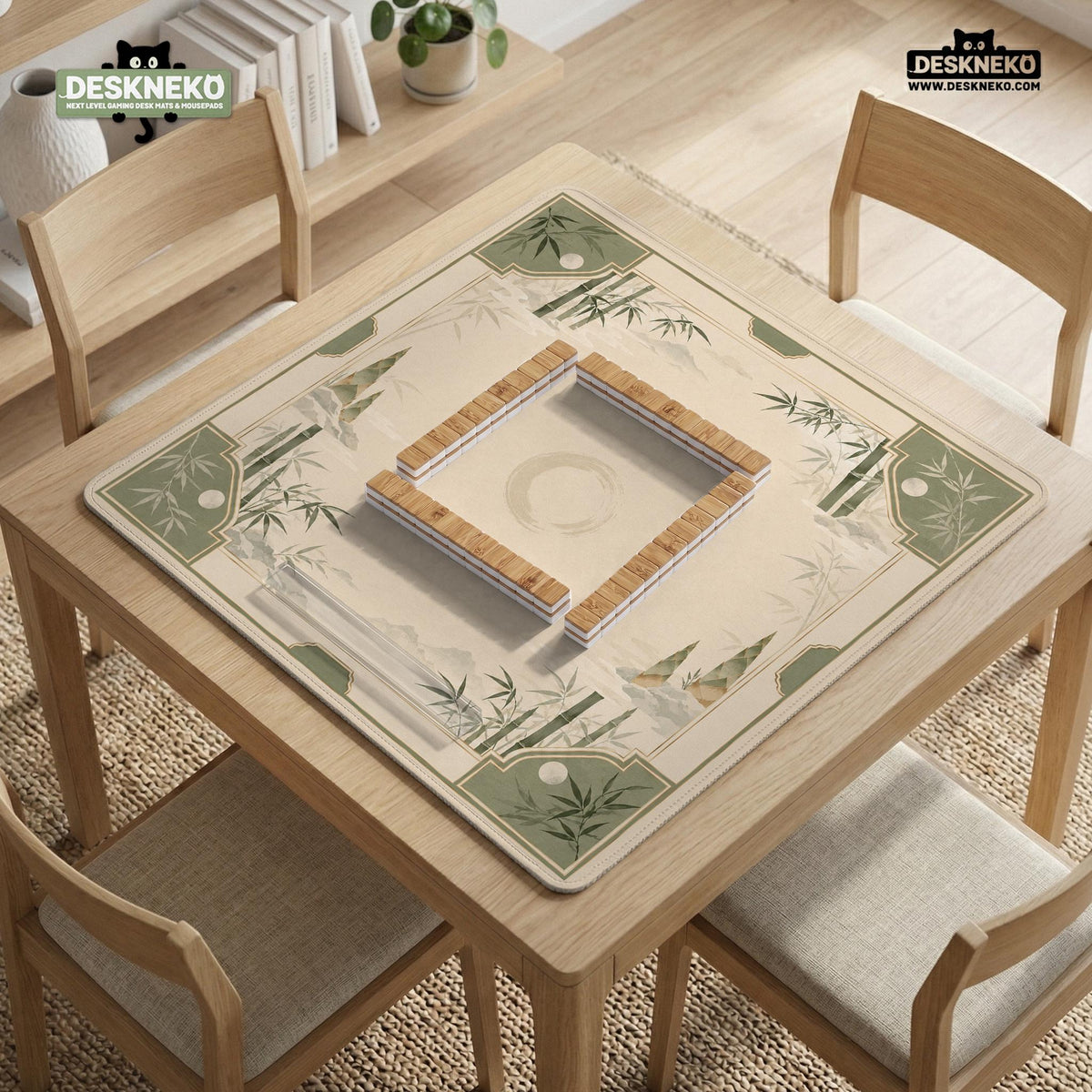 Square mahjong mat with a sage green bamboo and mountain design, cream center, scalloped border details, and gold line accents.