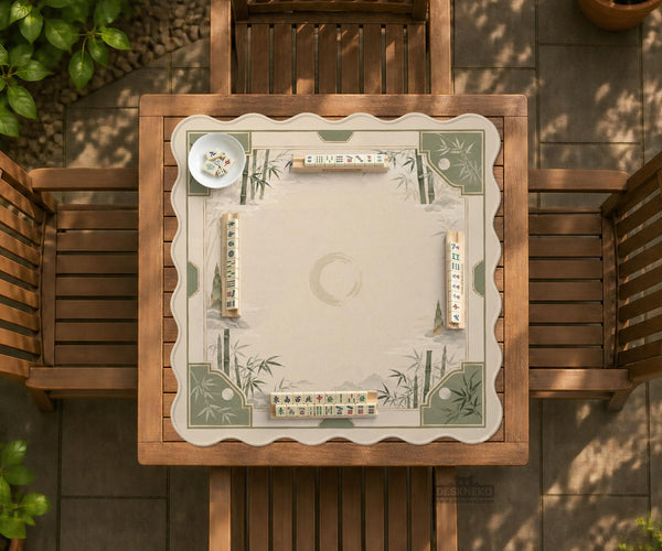Square mahjong mat with a sage green bamboo and mountain design, cream center, scalloped border details, and gold line accents.