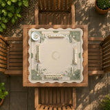 Square mahjong mat with a sage green bamboo and mountain design, cream center, scalloped border details, and gold line accents.