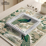 A green mahjong mat with peacock, floral, bamboo, pagoda, and gold border artwork in a scalloped chinoiserie style.