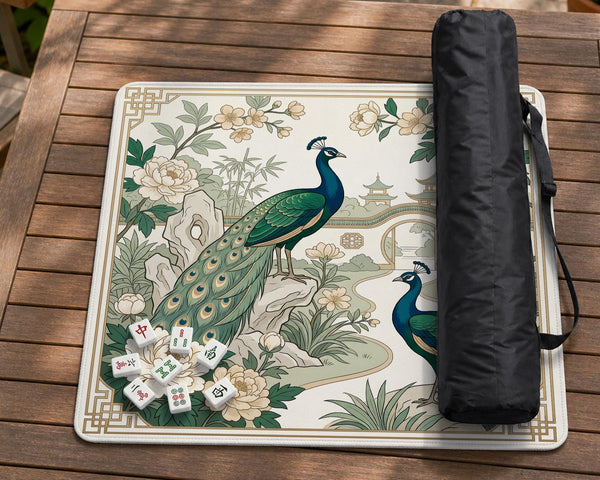 A green mahjong mat with peacock, floral, bamboo, pagoda, and gold border artwork in a scalloped chinoiserie style.