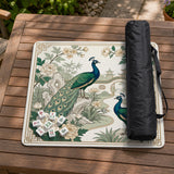 A green mahjong mat with peacock, floral, bamboo, pagoda, and gold border artwork in a scalloped chinoiserie style.
