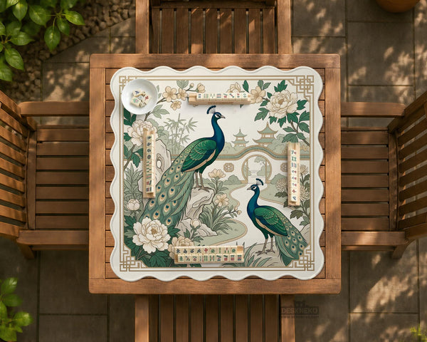 A green mahjong mat with peacock, floral, bamboo, pagoda, and gold border artwork in a scalloped chinoiserie style.