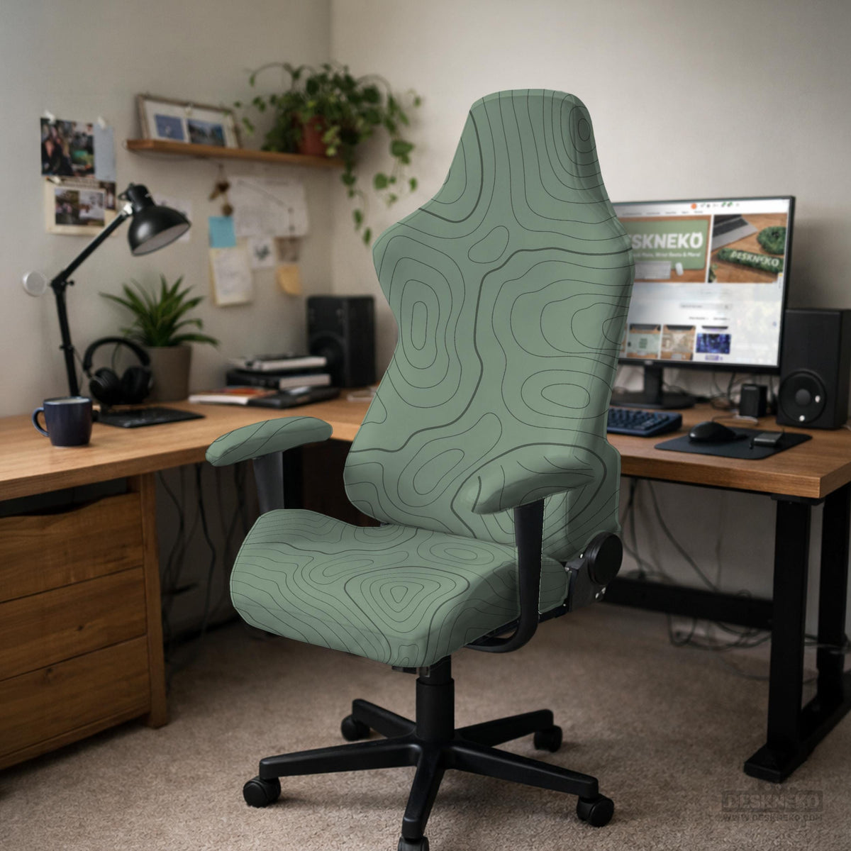 Sage green chair cover with a topographic contour-line pattern on a high-back gaming or office chair.