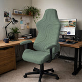 Sage green chair cover with a topographic contour-line pattern on a high-back gaming or office chair.