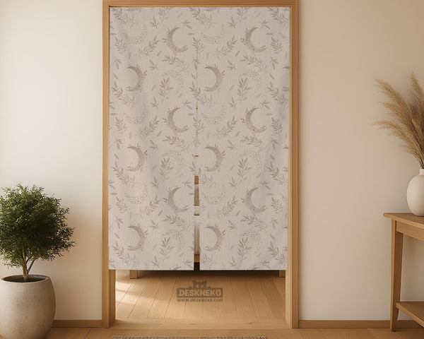 Beige door curtain with a crescent moon, leafy botanical branches, gray line art, and dotted celestial details.