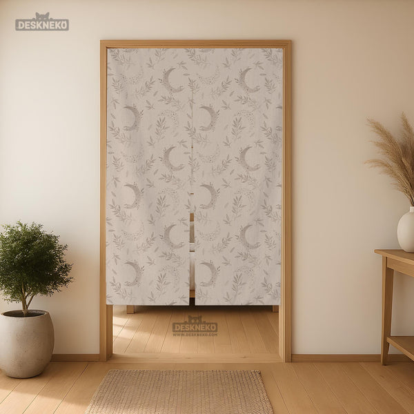 Beige door curtain with a crescent moon, leafy botanical branches, gray line art, and dotted celestial details.