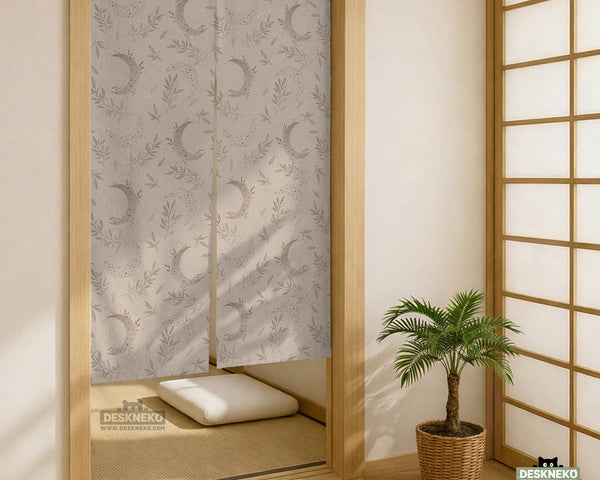 Beige door curtain with a crescent moon, leafy botanical branches, gray line art, and dotted celestial details.