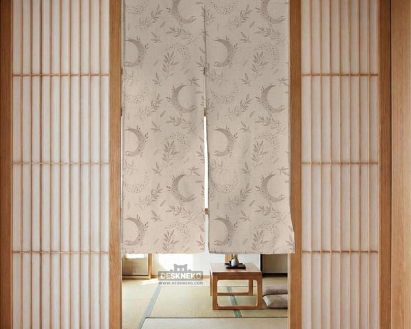 Beige door curtain with a crescent moon, leafy botanical branches, gray line art, and dotted celestial details.