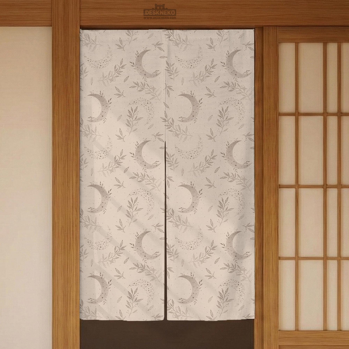 Beige door curtain with a crescent moon, leafy botanical branches, gray line art, and dotted celestial details.