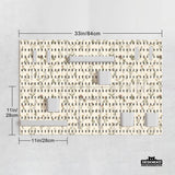 Cream pegboard wall organizer with small floral print, sage green stems, black slot layout, shelves, hooks, clips, and containers.