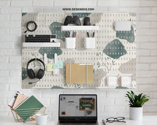 Four pegboard panels in sage green with cream, grey, teal, and leafy botanical artwork arranged in a square layout.