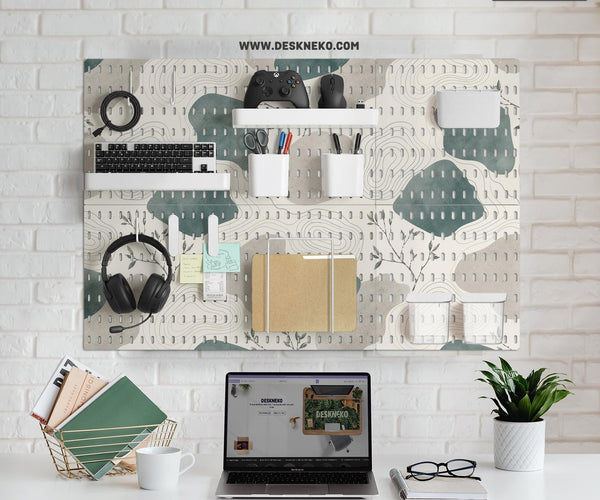 Four pegboard panels in sage green with cream, grey, teal, and leafy botanical artwork arranged in a square layout.