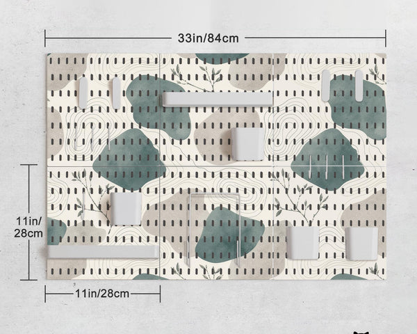 Four pegboard panels in sage green with cream, grey, teal, and leafy botanical artwork arranged in a square layout.