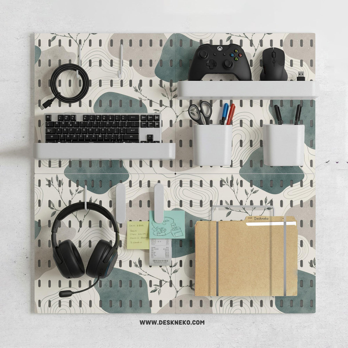 Four pegboard panels in sage green with cream, grey, teal, and leafy botanical artwork arranged in a square layout.