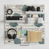 Four pegboard panels in sage green with cream, grey, teal, and leafy botanical artwork arranged in a square layout.