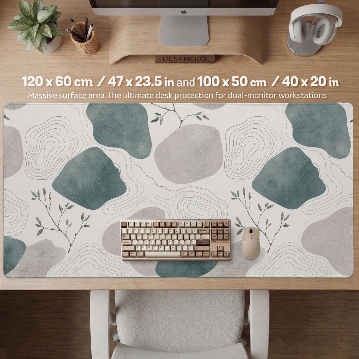 A desk mat with sage green abstract blocks, cream space, gray stone-like shapes, fine topographic contour lines, and small branch details.