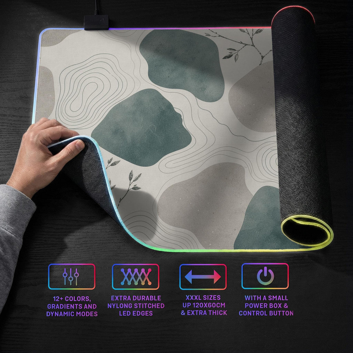 A desk mat with sage green abstract blocks, cream space, gray stone-like shapes, fine topographic contour lines, and small branch details.