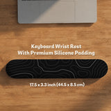 Black desk mat with a thin gray topographic contour line pattern.