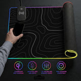 Black desk mat with a thin gray topographic contour line pattern.