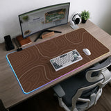 Brown desk mat with a repeating topographic contour line pattern in a neutral earth tone design.