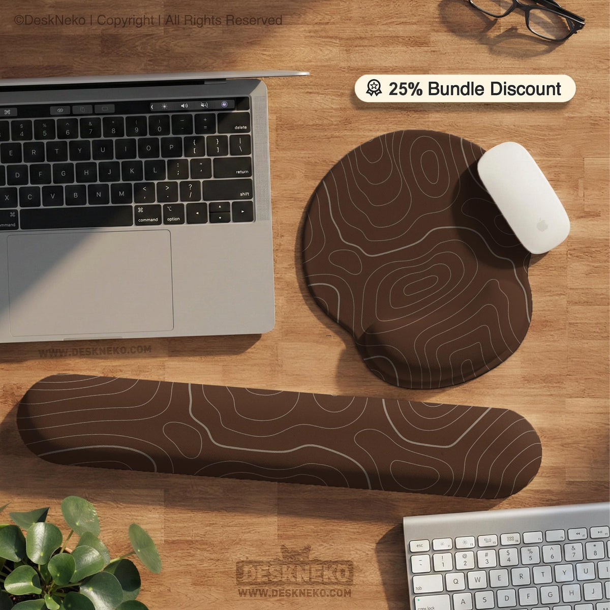 Brown desk mat with a repeating topographic contour line pattern in a neutral earth tone design.