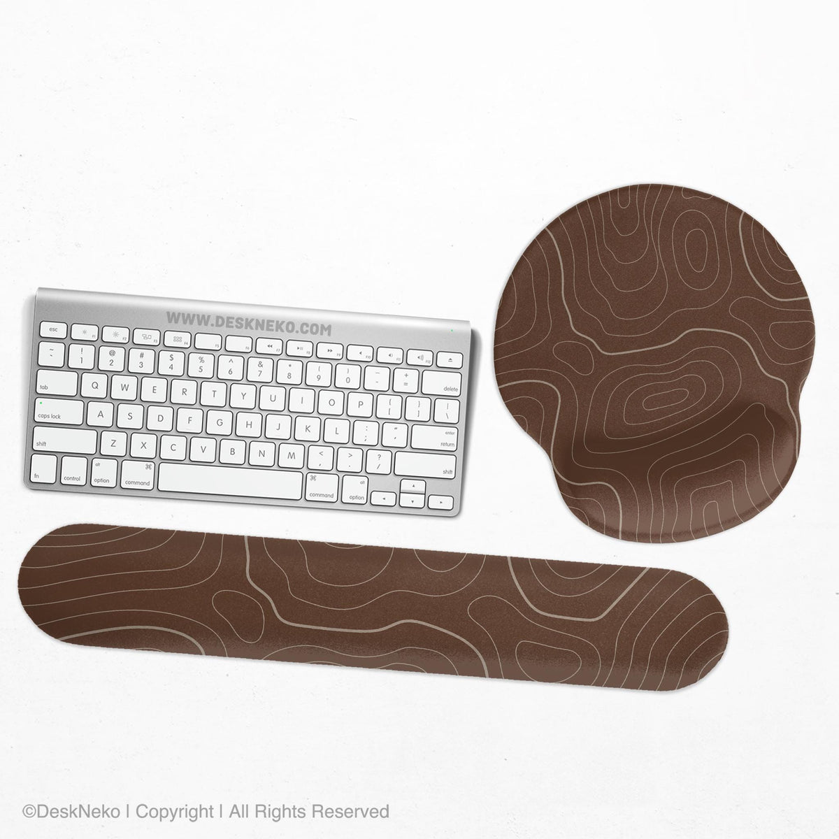 Brown mousepad and keyboard wrist rest with a topographic contour-line pattern.