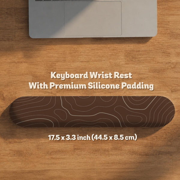 Brown mousepad and keyboard wrist rest with a topographic contour-line pattern.