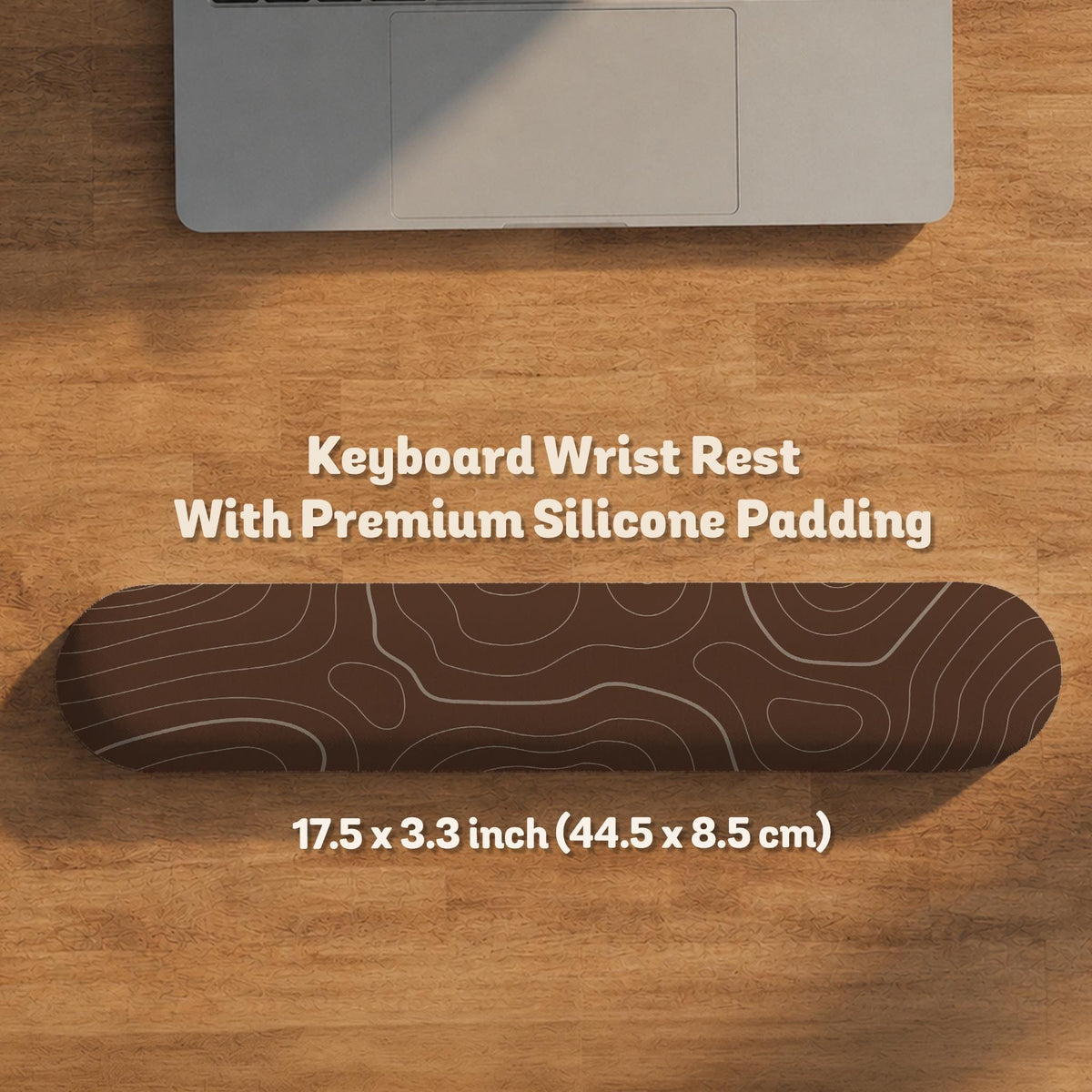Brown mousepad and keyboard wrist rest with a topographic contour-line pattern.