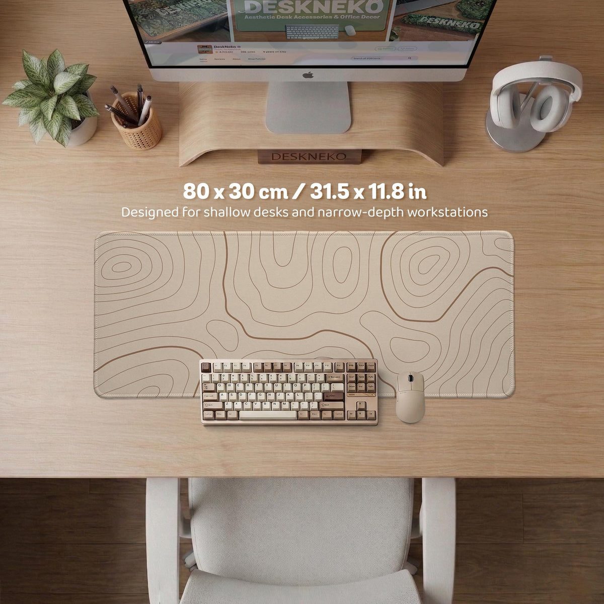 Beige desk mat with soft brown topographic contour lines on a neutral background.