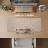 Beige desk mat with soft brown topographic contour lines on a neutral background.