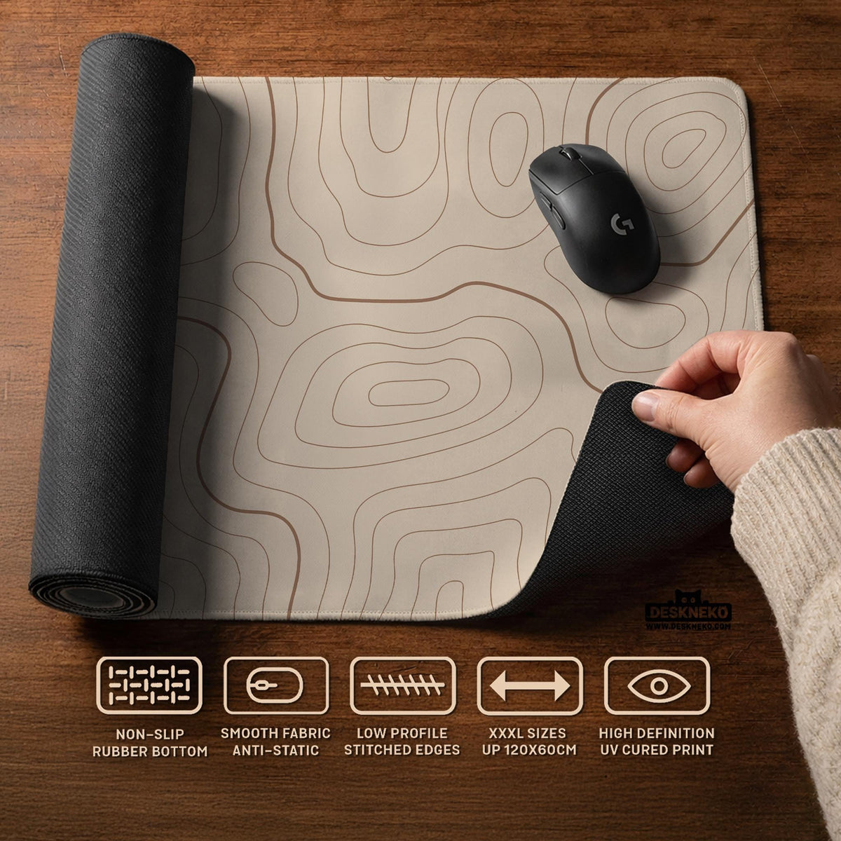 Beige desk mat with soft brown topographic contour lines on a neutral background.