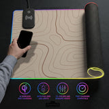 Beige desk mat with soft brown topographic contour lines on a neutral background.
