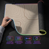 Beige desk mat with soft brown topographic contour lines on a neutral background.