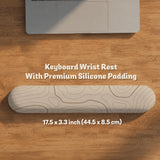 Beige desk mat with soft brown topographic contour lines on a neutral background.