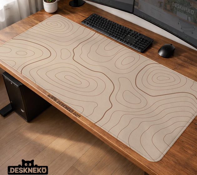 A beige mousepad with a topographic line pattern in a repeating design.