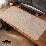 A beige mousepad with a topographic line pattern in a repeating design.