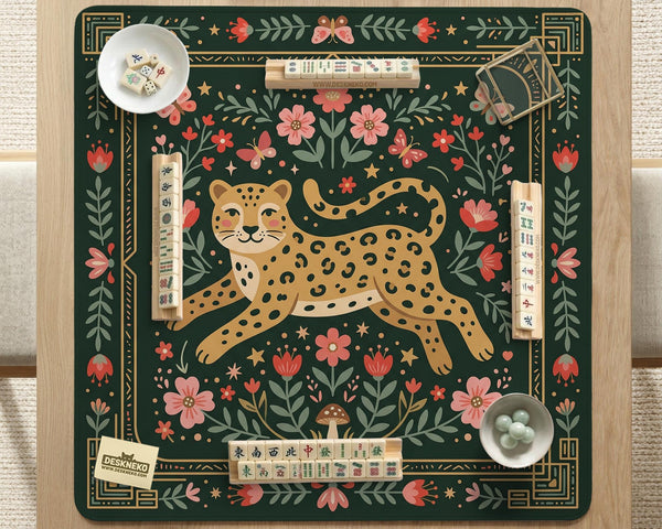 Dark green square mahjong mat with a golden spotted leopard in the center, surrounded by flowers, leafy stems, butterflies, and small star accents.