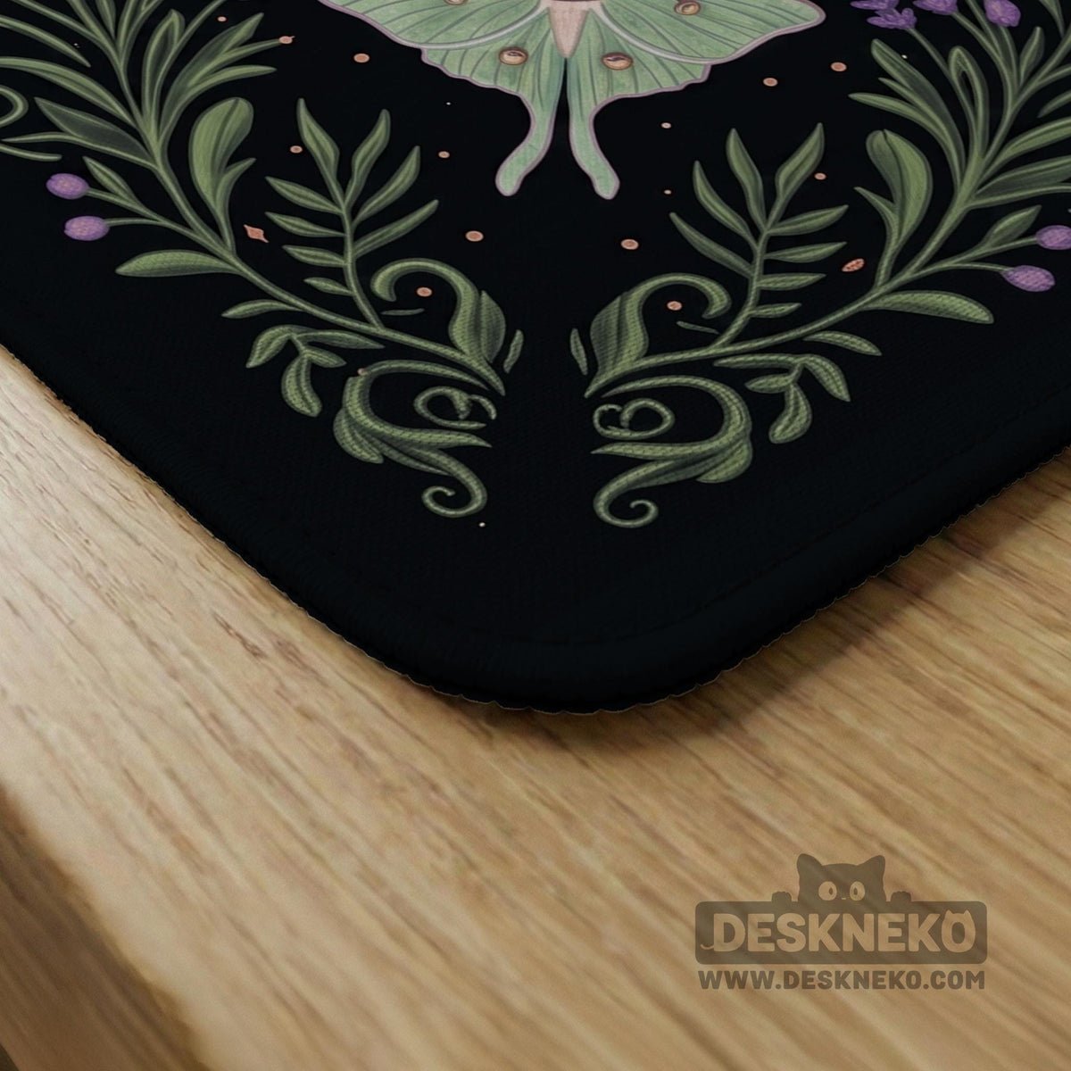 Black mahjong table mat with luna moths, purple flowers, soft green leaves, copper moons, and small star details.