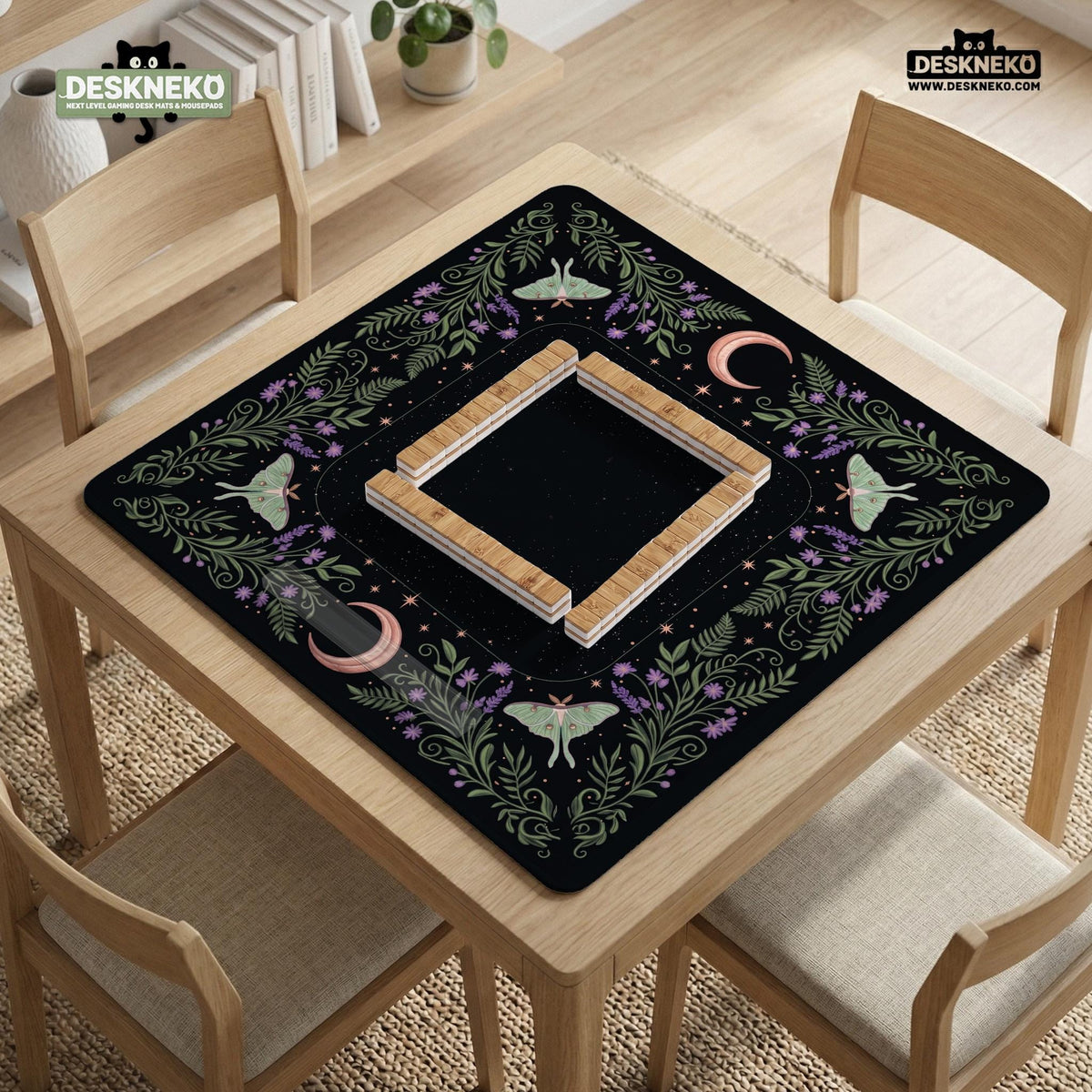 Black mahjong table mat with luna moths, purple flowers, soft green leaves, copper moons, and small star details.