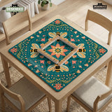 Green mahjong mat with a botanical bee and floral mandala design in teal, coral, cream, and gold.