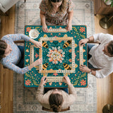 Green mahjong mat with a botanical bee and floral mandala design in teal, coral, cream, and gold.