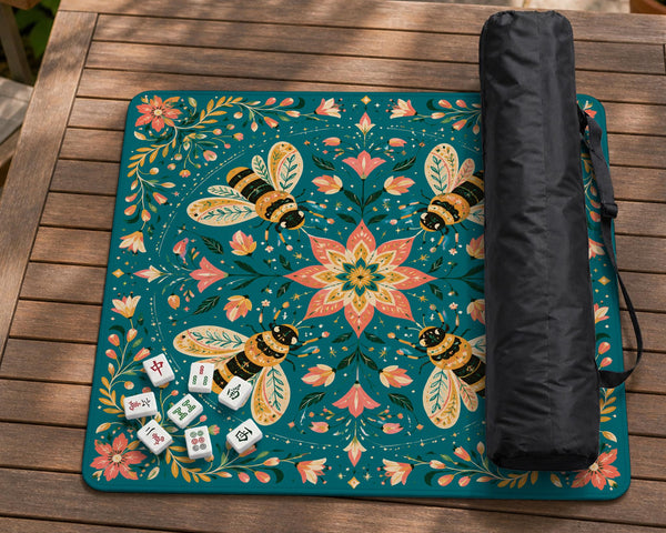 Green mahjong mat with a botanical bee and floral mandala design in teal, coral, cream, and gold.