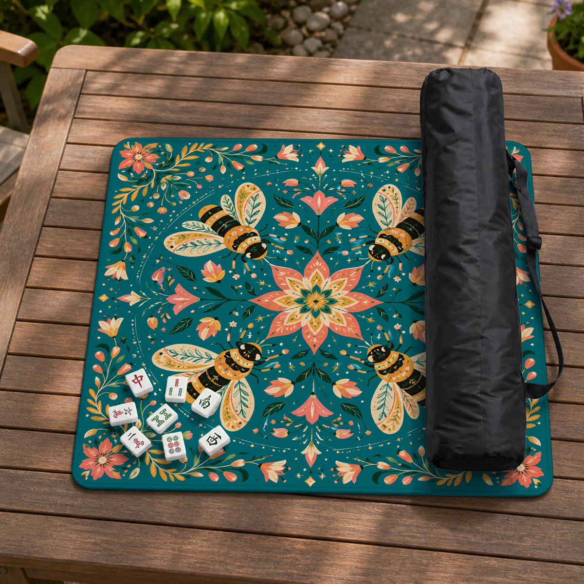 Green mahjong mat with a botanical bee and floral mandala design in teal, coral, cream, and gold.