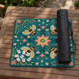 Green mahjong mat with a botanical bee and floral mandala design in teal, coral, cream, and gold.