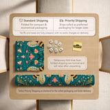 Green mahjong mat with a botanical bee and floral mandala design in teal, coral, cream, and gold.