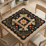 Black mahjong mat with a symmetrical botanical design, coral flowers, golden leaves, and small bees.