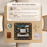 Black mahjong mat with a symmetrical botanical design, coral flowers, golden leaves, and small bees.