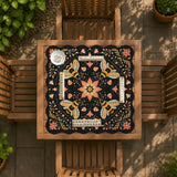 Black mahjong mat with a symmetrical botanical design, coral flowers, golden leaves, and small bees.