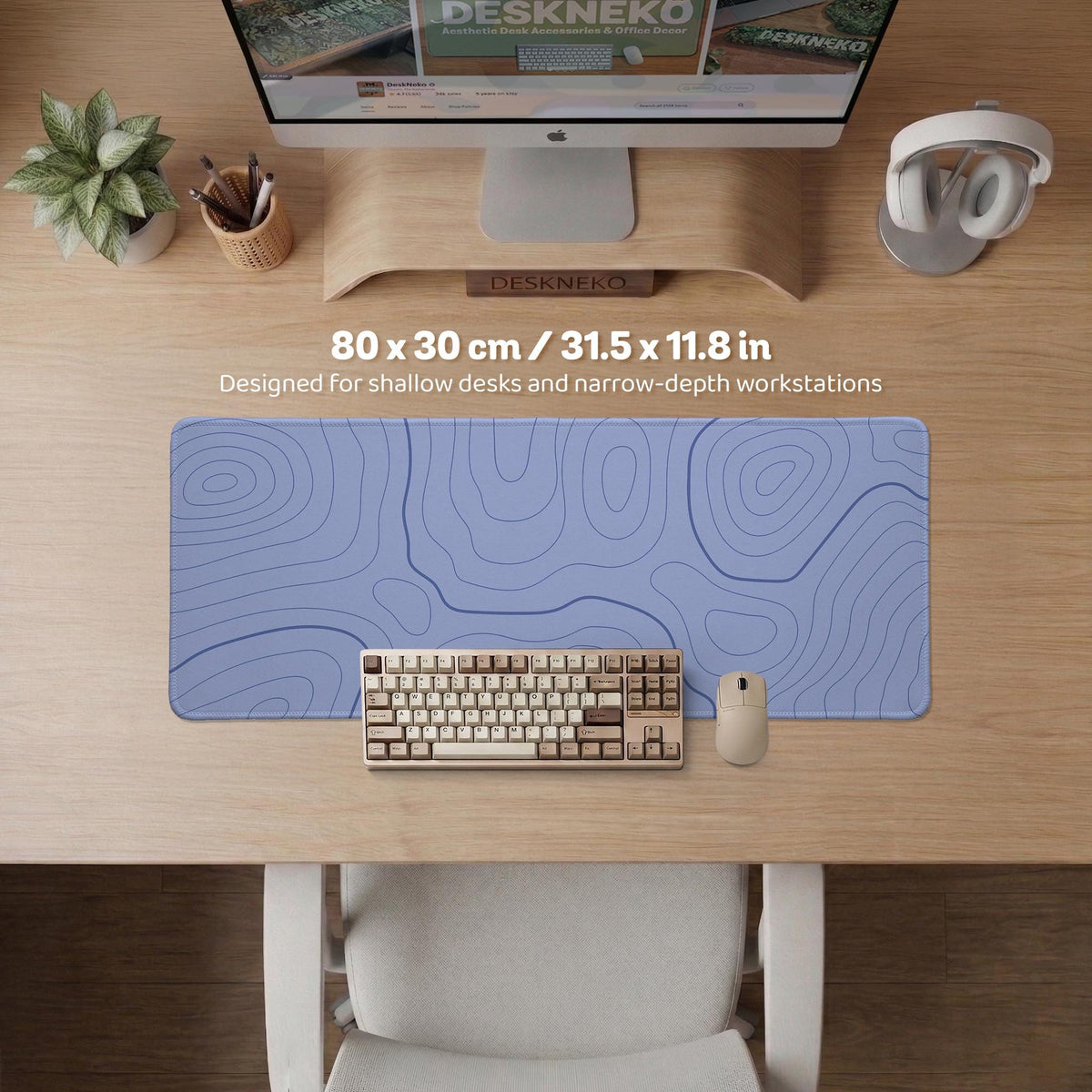 A pastel blue mousepad with an abstract topographic contour line pattern.